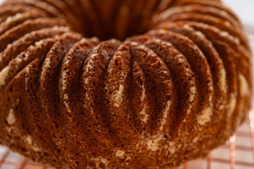 The artful extraction of the freshly baked bundt cake from its mold marks the exciting conclusion of the baking process.