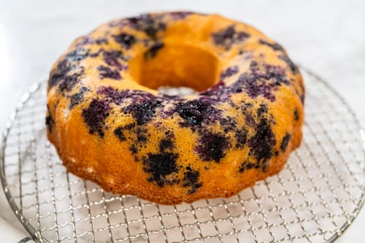 The artful extraction of the freshly baked bundt cake from its mold marks the exciting conclusion of the baking process.