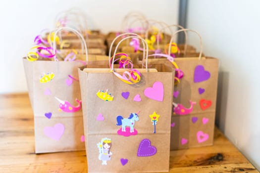 Party favors bags at the little girl's Birthday party.