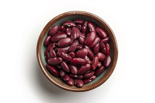 A white table holds a bowl filled with red beans.