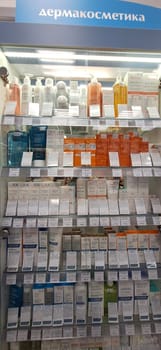 Bobruisk, Belarus - May 1, 2024: A selection of Avene sunscreens, hand creams, and skincare products neatly arranged on pharmacy shelves.