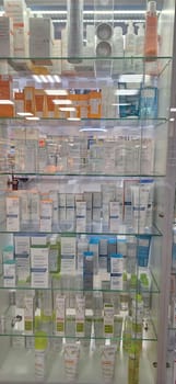 Bobruisk, Belarus - May 1, 2024: A selection of Avene sunscreens, hand creams, and skincare products neatly arranged on pharmacy shelves.