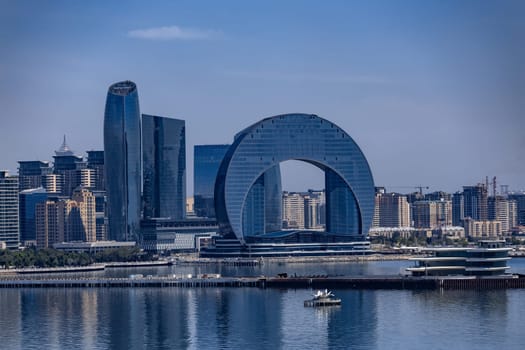 Baku city with a large building in the middle of it. The building is shaped like a circle