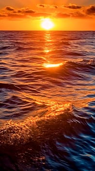 The sun is setting over the ocean, casting a warm glow on the water. The waves are small and gentle, creating a peaceful atmosphere