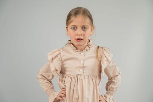 Portrait of a dissatisfied Caucasian girl on a white background