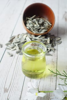 sunflower oil seed and oil in a container on table ,