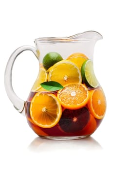 Sangria with slices of oranges lemons and limes in clear glass pitcher. Drink isolated on transparent background.