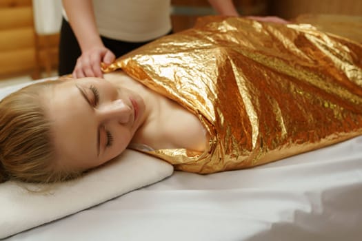 Caring about beauty and health. Body wraps in spa salon