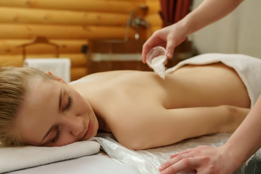 Spa. Portrait of relaxed girl during she getting massage