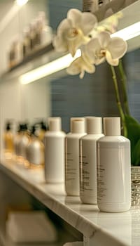 Close-up of stylish shampoo bottles on a bathroom shelf, with white orchids in the background.