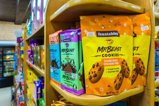 Sokuluk, Kyrgyzstan - April 5, 2024: Chocolate bars and cookies by Mr Beast on small store shelf, his company called Feastables that makes these and other treats