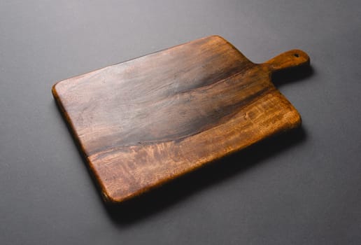 Top view of cutting board on dark gray background