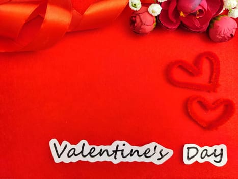 Valentine's Day concept celebration, congratulation. Red greeting Card with flower, Satin ribbon for Background, texture, place for text, copy space