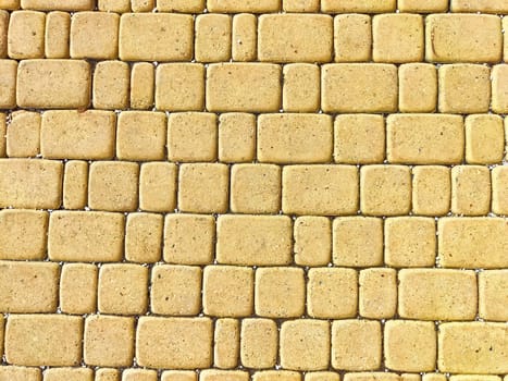 Bricks are like tiles on a sidewalk. Background, texture. Textured Brick Tile Pathway Under Daylight. A detailed view of a brick tile sidewalk with subtle color variations