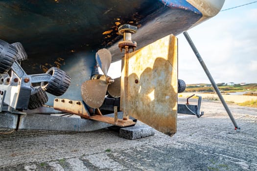 Propeller screw and rudder of vessel at Rosbeg harbour in County Donegal - Ireland