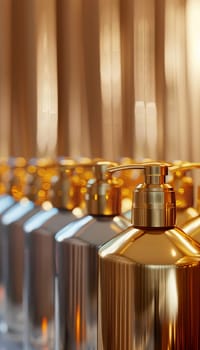 A close-up shot of a row of golden shampoo and conditioner bottles in a salon setting.