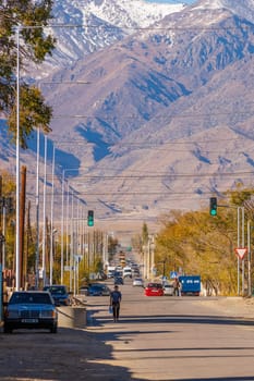 street of small Central Asia town at sunny autumn afternoon in Balykchy, Kyrgyzstan in October 21, 2022