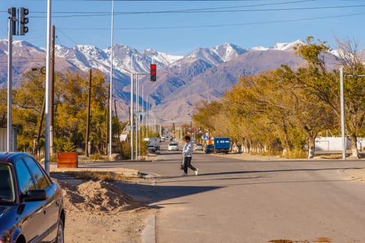 street of small Central Asia town at sunny autumn afternoon in Balykchy, Kyrgyzstan in October 21, 2022