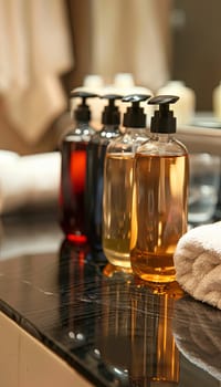 Close up of shampoo and conditioner bottles in a modern bathroom.