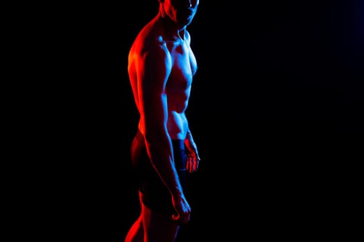 Portrait of man, bodybuilder and bicep flex in a studio, background and exercise for muscular power.