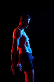 Portrait of man, bodybuilder and bicep flex in a studio, background and exercise for muscular power.