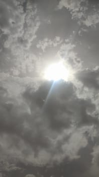 gray sky, clouds white sun, nature weather air background. High quality photo
