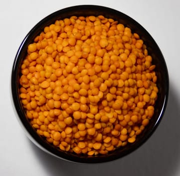 Close up picture of red lentils. Source of carbohydrates, vegetable proteins, fibre, vitamins, minerals .Low fat content. Vegan food