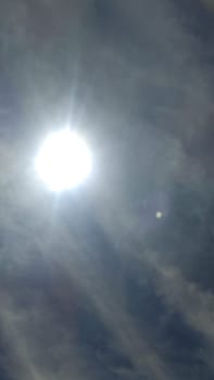 sun sky clouds rays of light background nature. High quality photo