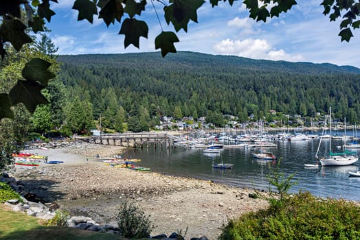 Deep Cove bay area with yacht on the water.