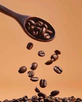 Coffee beans falling from a wooden spoon on an orange background for coffee advertisement or cafe menu