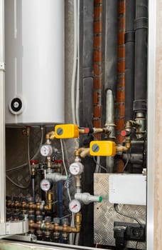 A complex of pipes and measuring devices provides water supply.