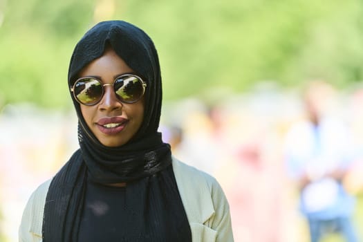 African American Muslim woman in hijab explores natural bee farms for honey production, blending tradition with sustainability in the serene countryside.