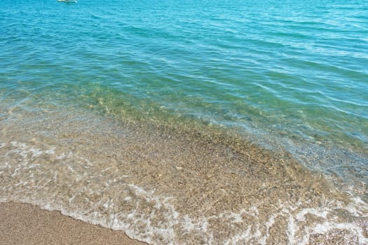 view of the clear turquoise sea and waves.