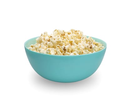 popcorn in a ceramic bowl on a wooden table