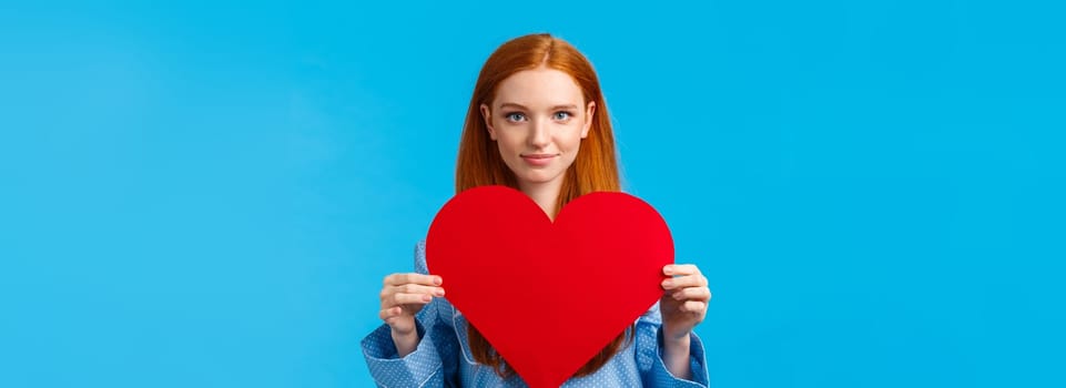 . Showing my affection. Valentines day concept. Confident and bold cute redhead woman in nightwear holding huge heart gesture and smiling, expressing love and admiration, confessing.