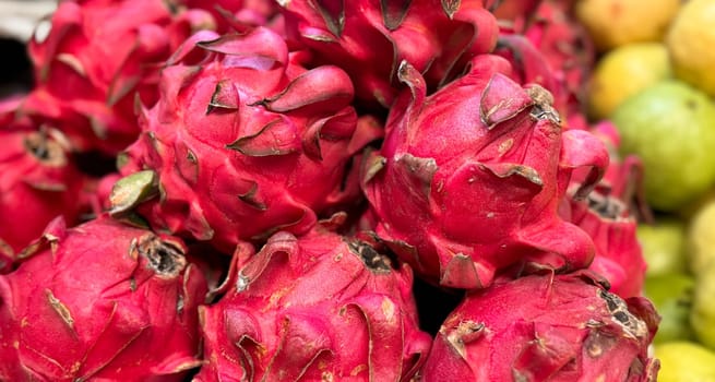 Fresh produce of dragon fruits or Hylocereus undatus 0r buah naga in Indonesian at the local market, healthy fresh fruit for salad or juice or any cooking options good for cooking recipes