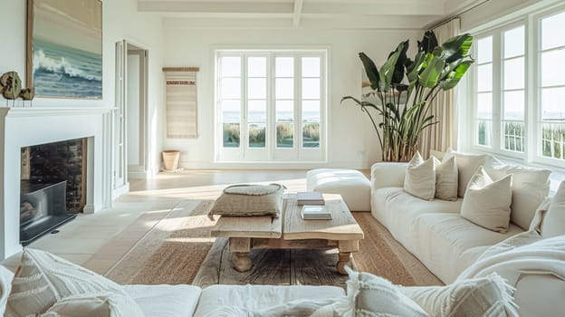 Interior of a living room with white walls, sofa and cushions. Sitting room in coastal cottage with sea view. Luxury lounge room