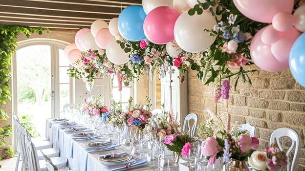 Birthday table decoration with sweets, flowers, candles and pink balloons. Selective focus