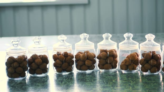 close-up, stored in glass jars are seeds, walnuts, various species grown on breeding, hybrids of nuts. nuts of the best quality. nut for pedigreed horses. High quality photo