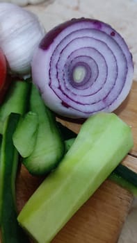 vegetables food, red onion, fresh green cucumber, vegetarian dish, snack. High quality photo