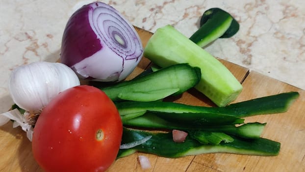 vegetables food, red onion, garlic tomato fresh green cucumber, vegetarian dish, snack. High quality photo