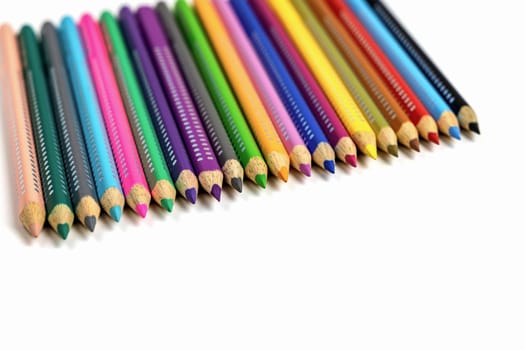 Colored pencils for drawing various colors andcoloring book for children. High quality photo