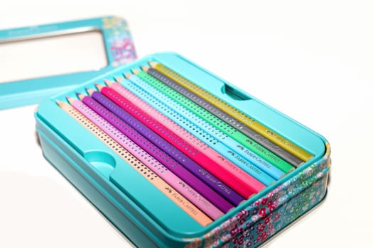 Colored pencils for drawing various colors on a white background. Copenhagen, Denmark - January 24, 2024