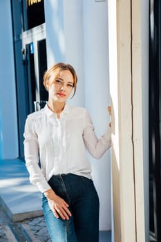 woman stands outside the store walking outside