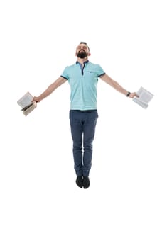 Knowledge inspire. Man posing with books while jumping