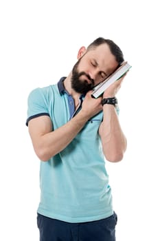 Image of bearded man fell asleep while reading boring book