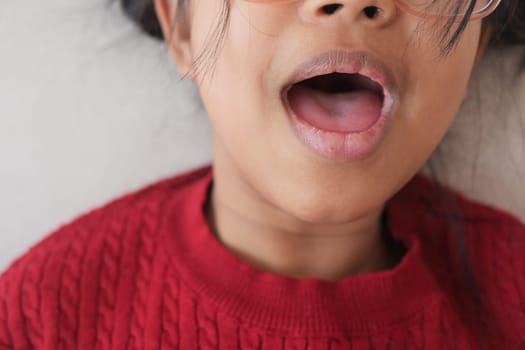 close up of child screaming at home , slow motion