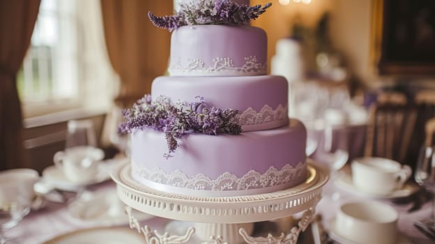 Wedding cake with lavender flowers. Festive table decoration.