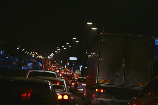 a line of road traffic at or near a standstill because of road construction, an accident, or heavy congestion