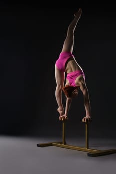 Tightrope walker training. Photo on gray background